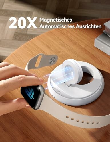 Magnetische Ladestation für Smartwatch auf einem Tisch.